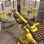 ROBOTICALLY TENDED GRIT- BLASTING CELL